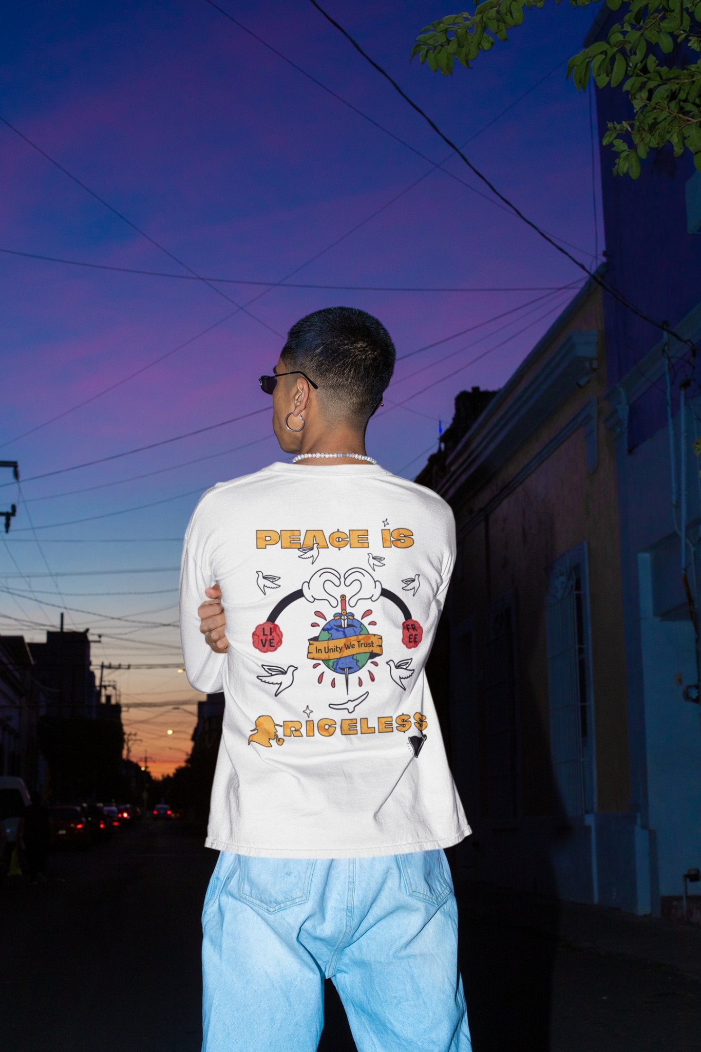 Man wearing white Champion long sleeve crew neck shirt, Munchy Merchy